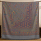 Grey pashmina wool shawl folded, showing the woven paisley detail