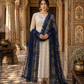 Woman in traditional attire with a blue dupatta in an ornate indoor setting