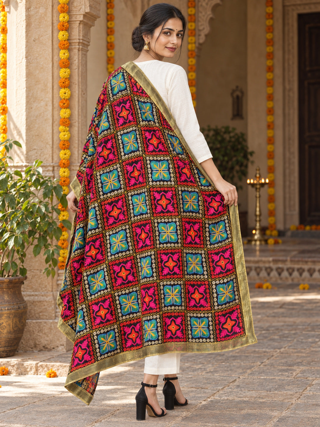 Dp2-Hv-101 — rear three-quarter drape showing Phulkari embroidery and border