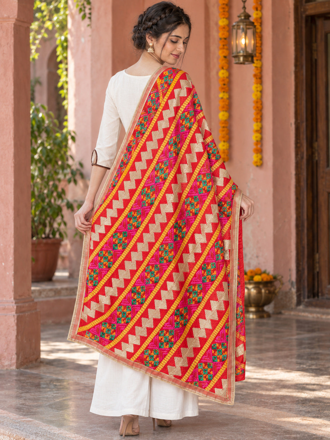 Dp2-Hv-105 — rear three-quarter drape showing Phulkari embroidery and border