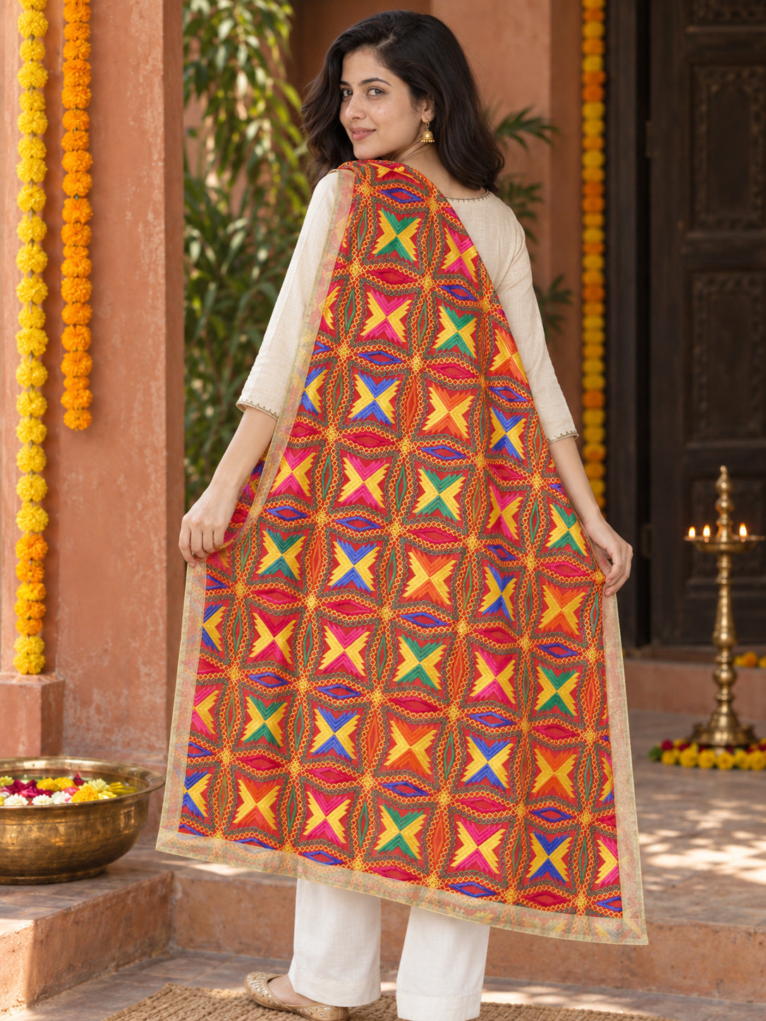 HV-BUTTERFLY — rear three-quarter drape showing Phulkari embroidery and border