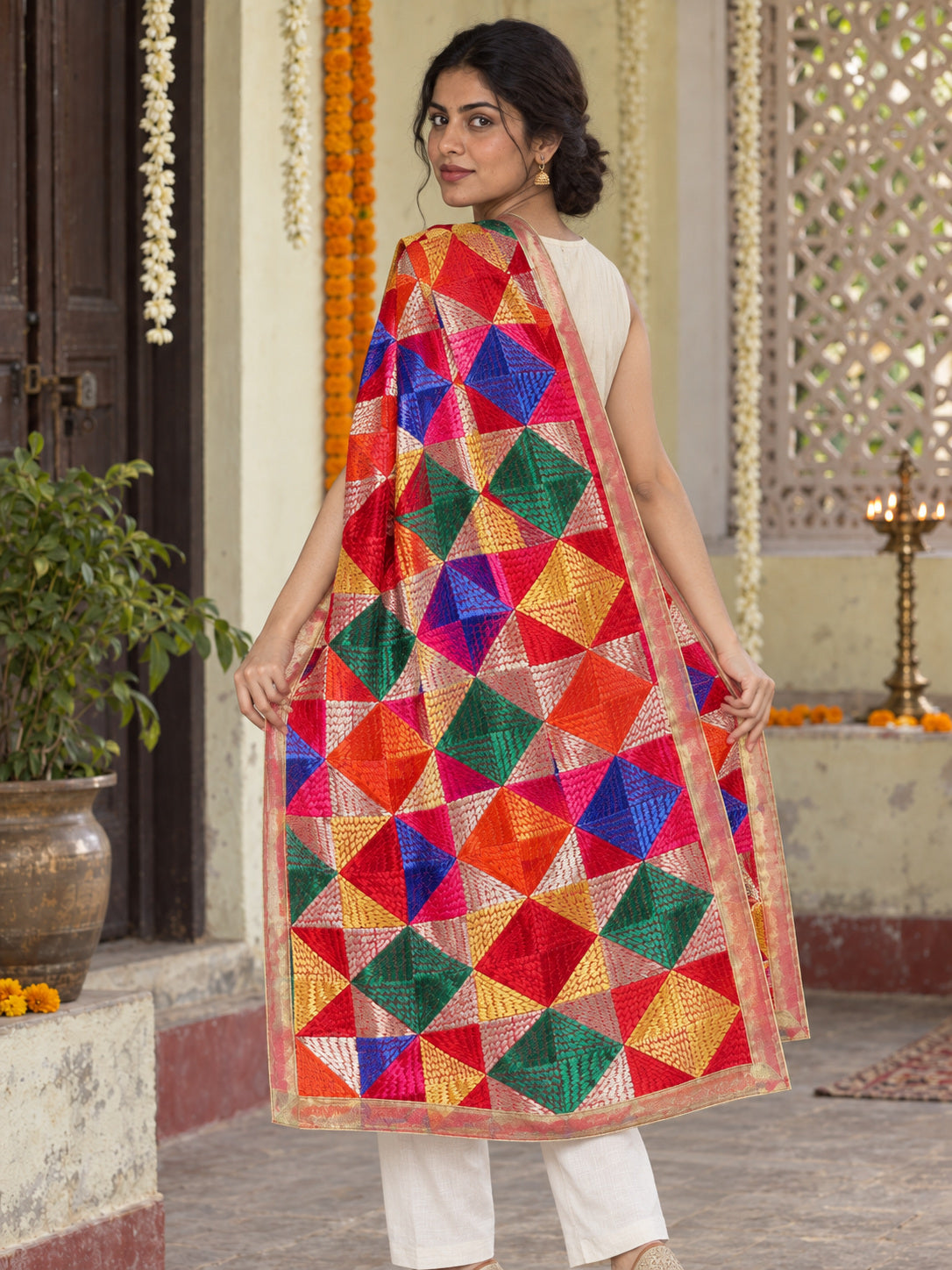 HV-PANKH — rear three-quarter drape showing Phulkari embroidery and border