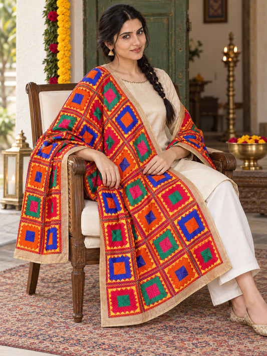 HV-PEACOCK — elegant seated Phulkari drape, festive primary portrait