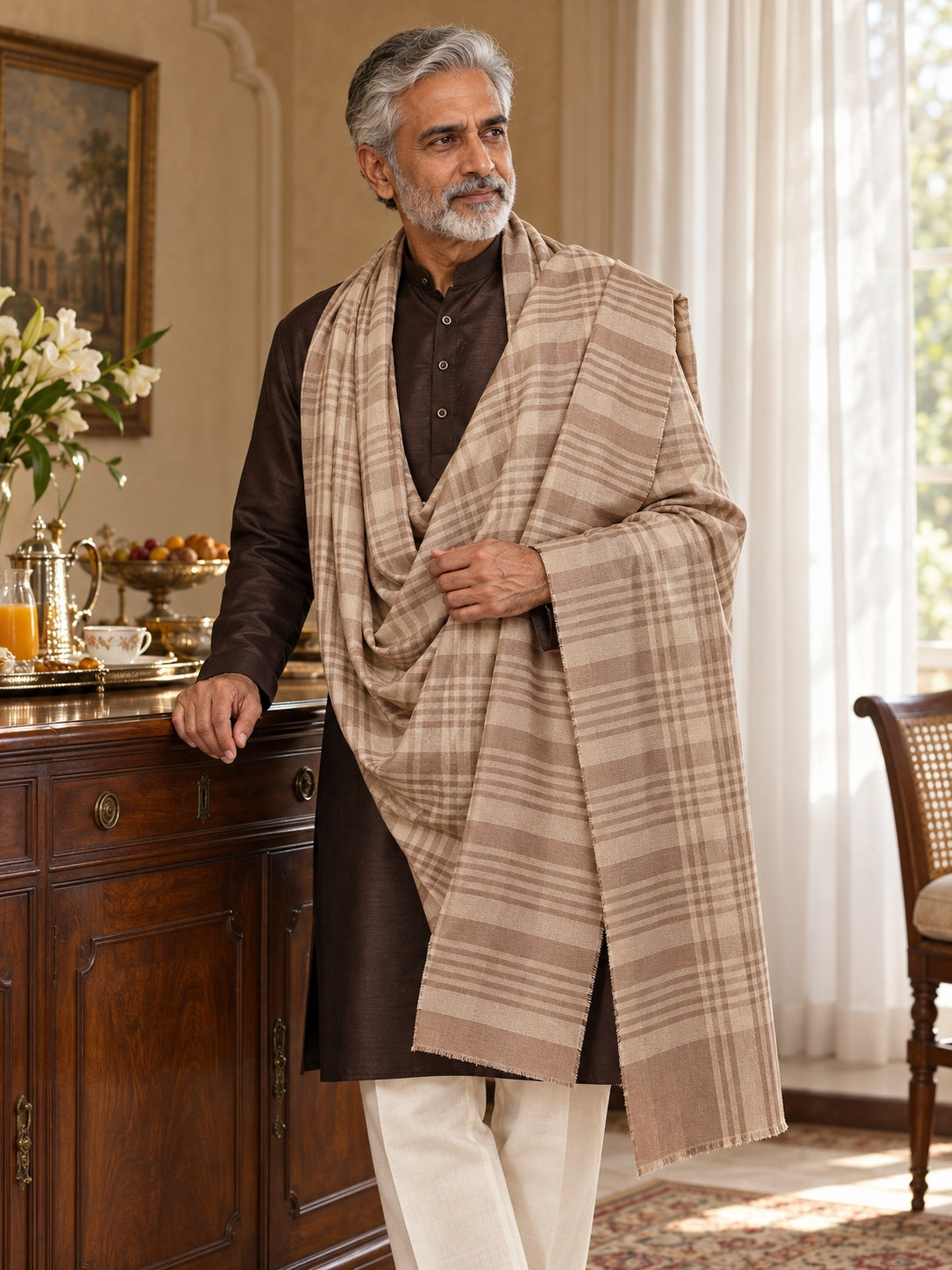 Weavers Villa MS-CHECKS-BEIGE men's shawl styled on a premium model in a royal setting, view 1.