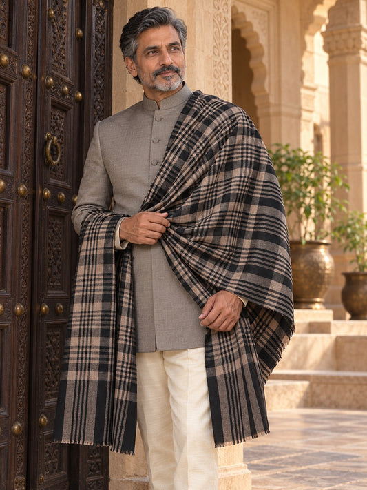 Weavers Villa MS-CHECKS-BLACK men's shawl styled on a premium model in a royal setting, view 1.
