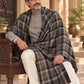 Weavers Villa MS-CHECKS-BLACK men's shawl styled on a premium model in a royal setting, view 2.