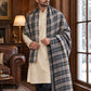 Weavers Villa MS-CHECKS-CHARCOAL men's shawl styled on a premium model in a royal setting, view 1.