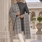 Weavers Villa MS-CHECKS-GREY men's shawl styled on a premium model in a royal setting, view 2.