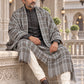 Weavers Villa MS-CHECKS-GREY men's shawl styled on a premium model in a royal setting, view 3.