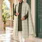 Weavers Villa MS-CHECKS-PISTA men's shawl styled on a premium model in a royal setting, view 1.