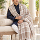 Weavers Villa MS-CHECKS-WHITE men's shawl styled on a premium model in a royal setting, view 2.