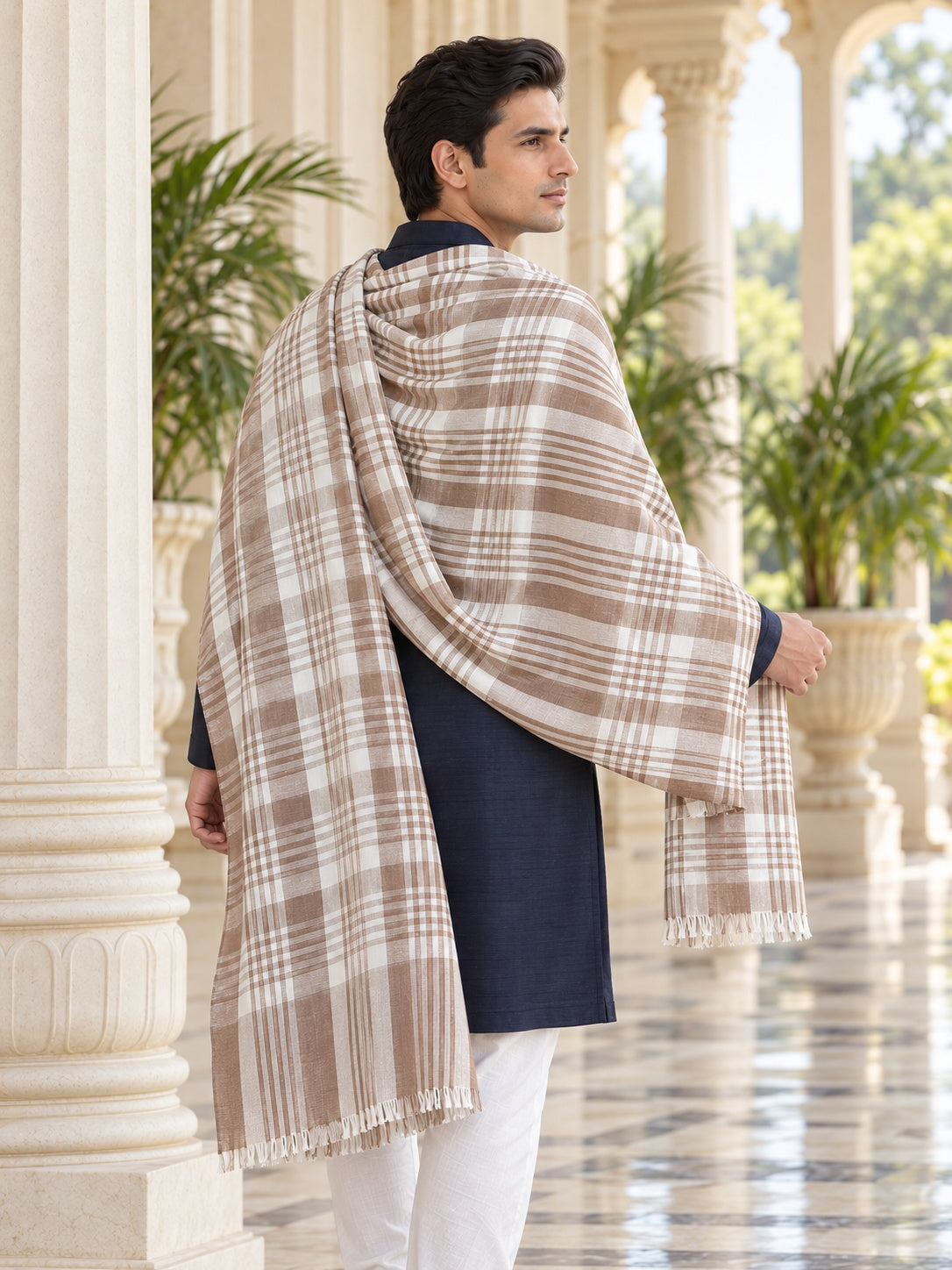 Weavers Villa MS-CHECKS-WHITE men's shawl styled on a premium model in a royal setting, view 3.