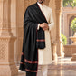 Weavers Villa MS-KINAURI-BLACK men's shawl styled on a premium model in a royal setting, view 2.