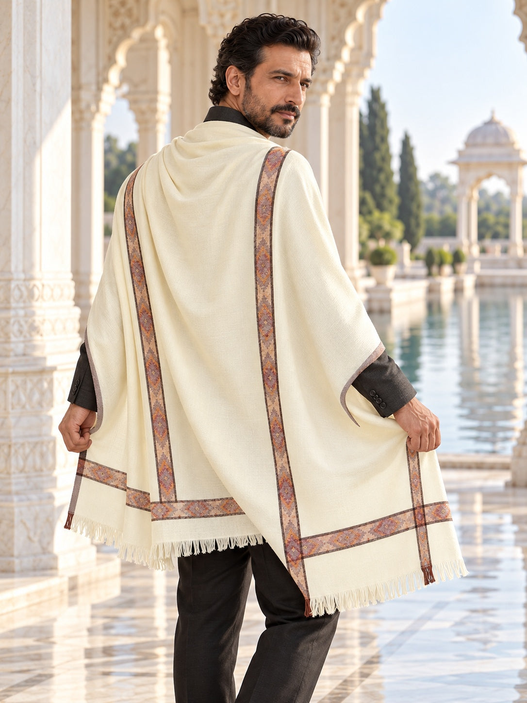 Weavers Villa MS-KINAURI-WHITE men's shawl styled on a premium model in a royal setting, view 3.