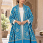 Ferozi blue patterned shawl in an elegant open shoulder drape on a female model in an Indian heritage haveli