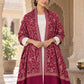 MAROON patterned shawl in an elegant open shoulder drape on a female model in an Indian heritage haveli