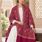 MAROON patterned shawl in an elegant seated wrap on a female model in an Indian heritage haveli