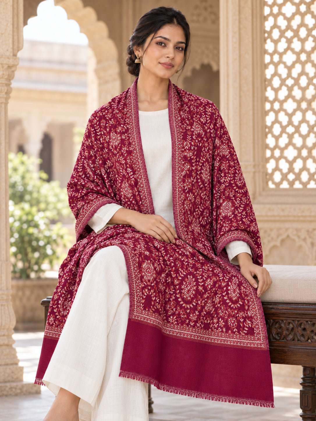 MAROON patterned shawl in an elegant seated wrap on a female model in an Indian heritage haveli