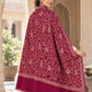 MAROON patterned shawl in an elegant rear drape on a female model in an Indian heritage haveli