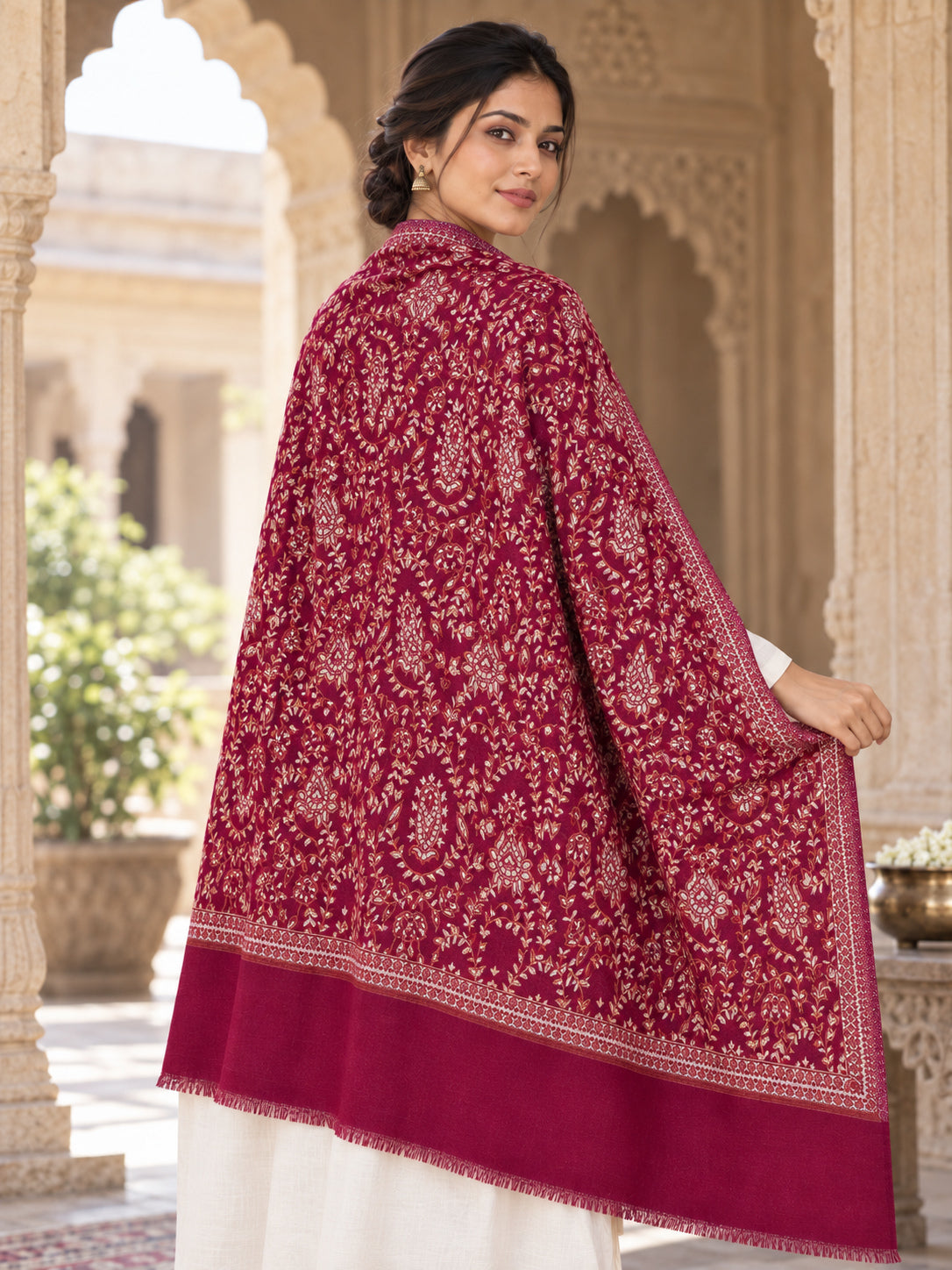 MAROON patterned shawl in an elegant rear drape on a female model in an Indian heritage haveli