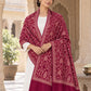 MAROON patterned shawl in an elegant front crossed wrap on a female model in an Indian heritage haveli