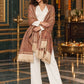 Beige paisley woven shawl styled on a model in a luxurious festive palace setting — standing showcase