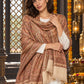 Beige paisley woven shawl styled on a model in a luxurious festive palace setting — detailed shoulder wrap