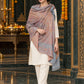 Grey paisley woven shawl styled on a model in a luxurious festive palace setting — standing showcase
