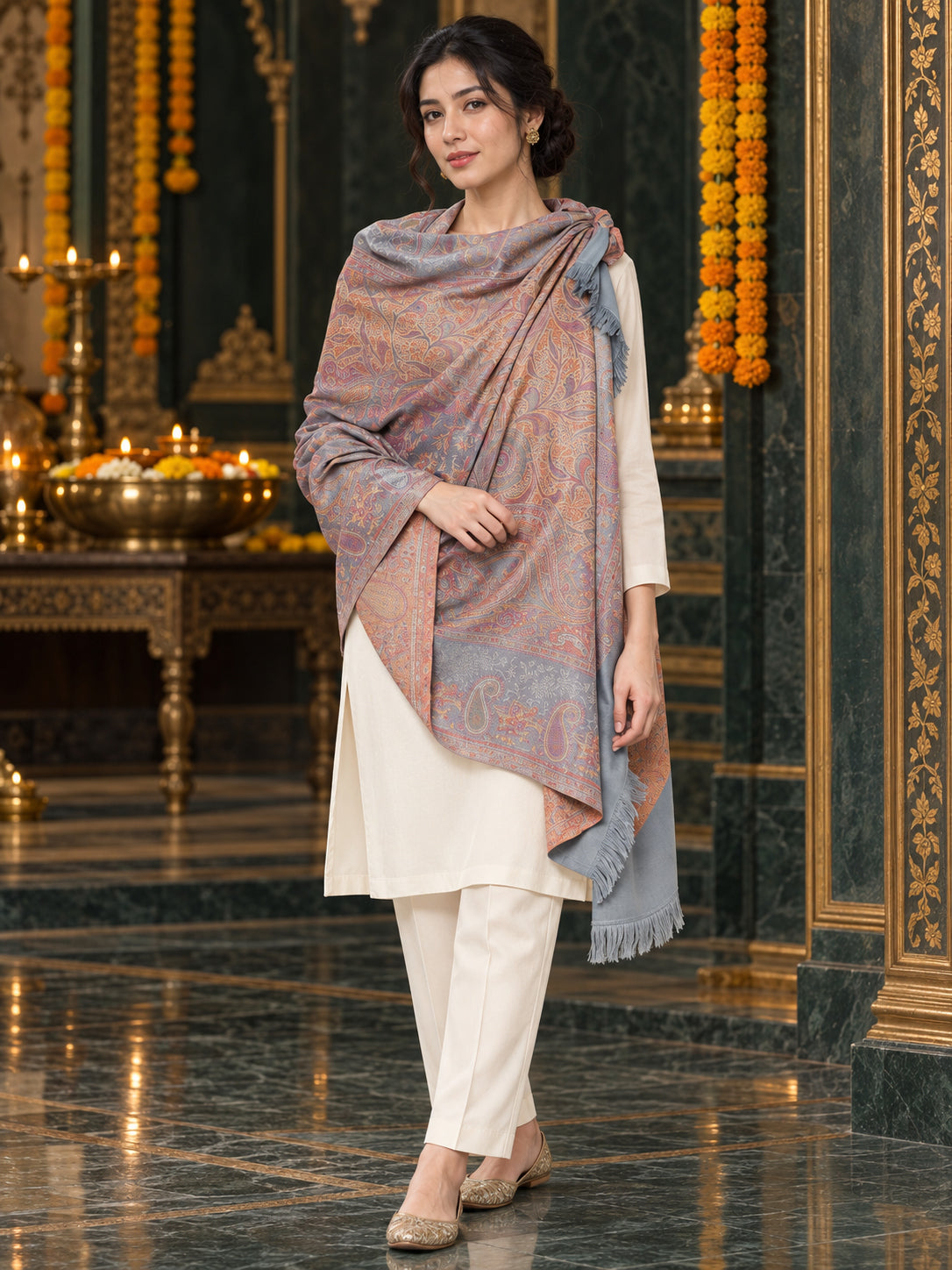 Grey paisley woven shawl styled on a model in a luxurious festive palace setting — standing showcase
