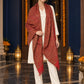 Maroon paisley woven shawl styled on a model in a luxurious festive palace setting — long stole
