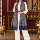 Navy Blue paisley woven shawl styled on a model in a luxurious festive palace setting — belted wrap