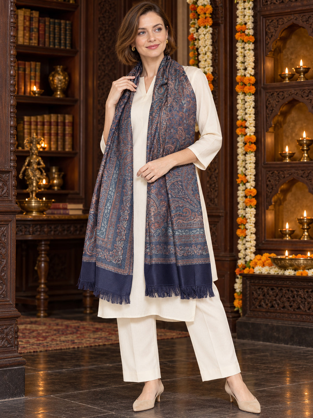 Navy Blue paisley woven shawl styled on a model in a luxurious festive palace setting — single-shoulder styling