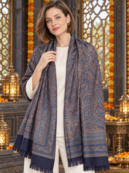 Navy Blue paisley woven shawl styled on a model in a luxurious festive palace setting — detailed shoulder wrap