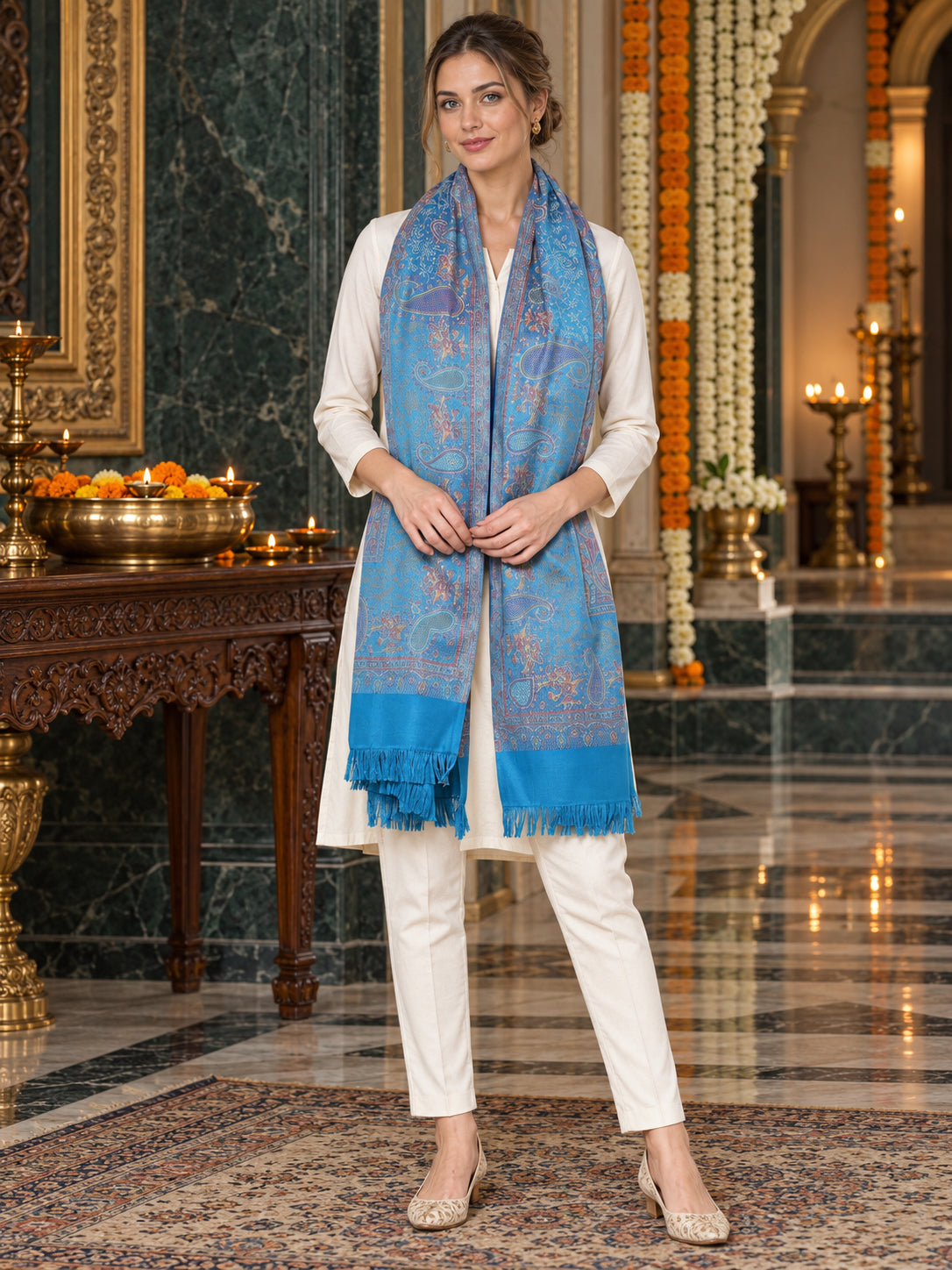 Sky Blue paisley woven shawl styled on a model in a luxurious festive palace setting — long stole
