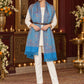 Sky Blue paisley woven shawl styled on a model in a luxurious festive palace setting — belted wrap