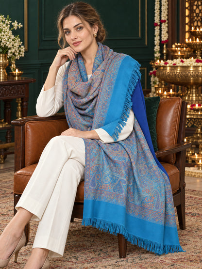 Sky Blue paisley woven shawl styled on a model in a luxurious festive palace setting — seated salon