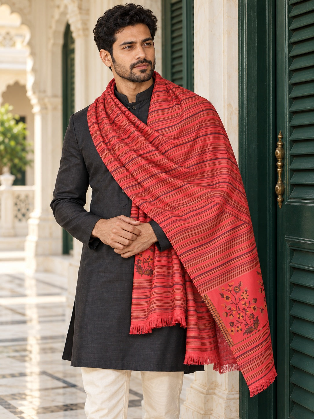 Weavers Villa MS-512-GAJARI men's shawl styled on a premium model in a royal setting, view 1.