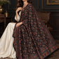 Black Kani shawl styled in a seated shoulder drape in a dark heritage salon | WV-401-BLACK-1